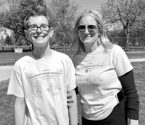 CELEBRATING EACH OTHER: Event organizer and Zane North K-2 Teacher Kelly Curley, right, enjoys the day with Zane North student Patrick Bradley.