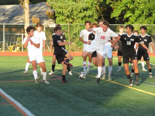 FORMIDABLE HAWKS: Haddon Township’s boys soccer team pulled off a feat Group 1 programs almost never accomplish - winning the South Jersey Soccer Coaches Tournament. Here, in unrelated action, number 16 Ian Hewitt battles for control of the ball against local rival Haddonfield. photo by Marc Narducci