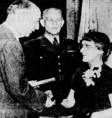 POSTHUMOUS HONORS: Above: Nelson Brittin’s mother, Anna, receives the Medal of Honor, awarded posthumously to her son from Secretary of Defense, Robert Lovett, as Army Chief of Staff, John E. Hull, looks on. Below, The USNS Brittin is christened on October 21, 2000